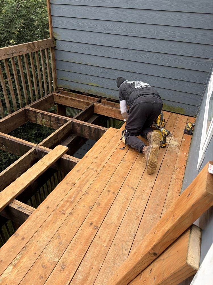 During: new deck boards going down over the framing