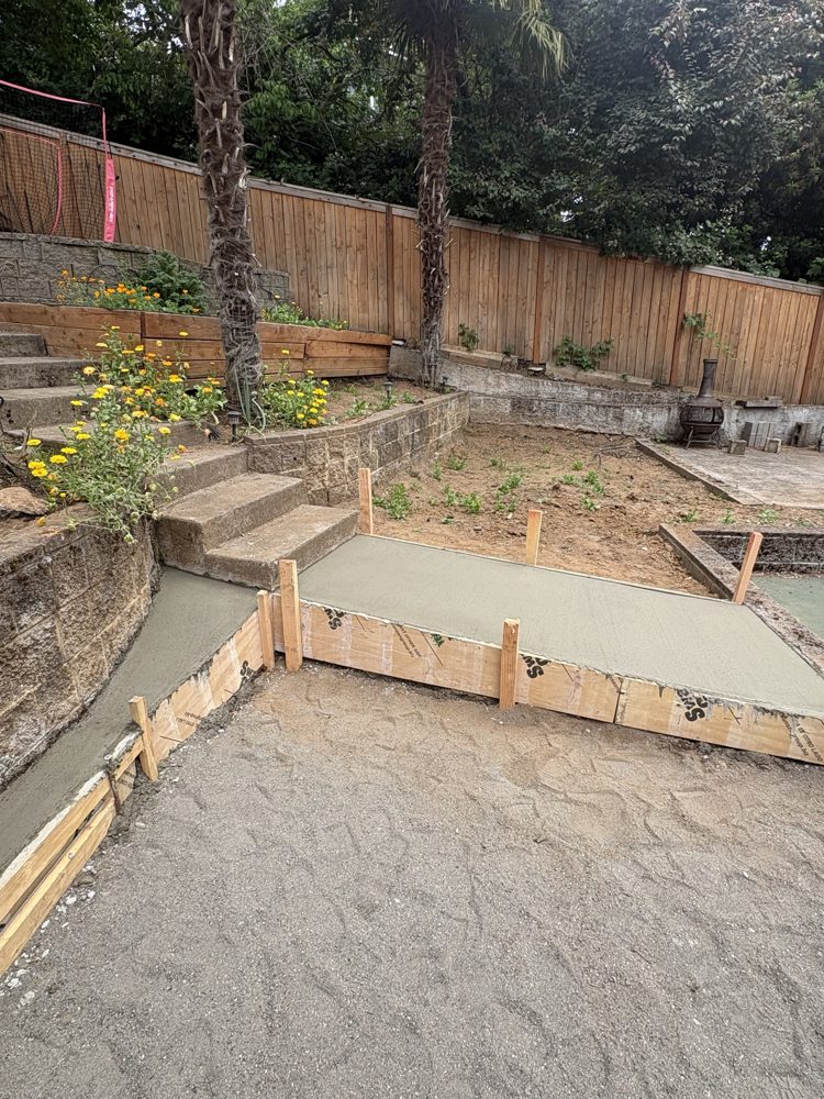 New concrete walkway and landing poured at the base of the steps