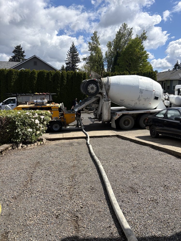 Concrete pump hose run from the mixer truck up the driveway