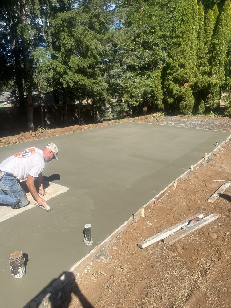 Hand-finishing a large new concrete slab