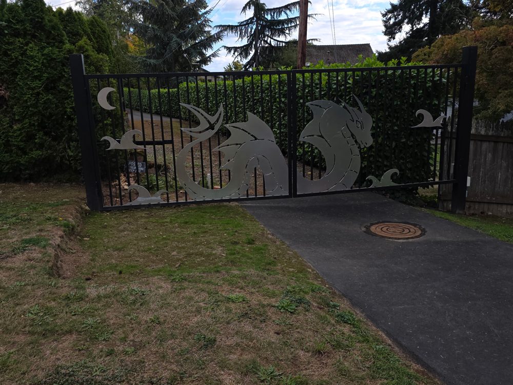 Custom dragon gate, angled view across the driveway