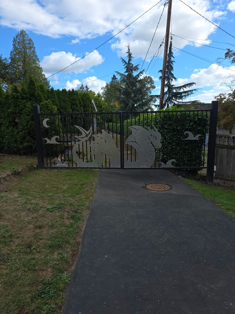 Custom dragon driveway gate, straight-on view from the street