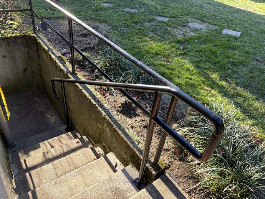 New handrail at the top of an exterior stairway