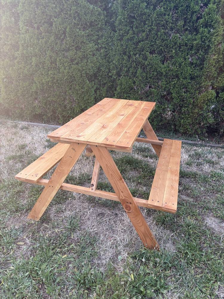 Handbuilt wooden picnic table, side view