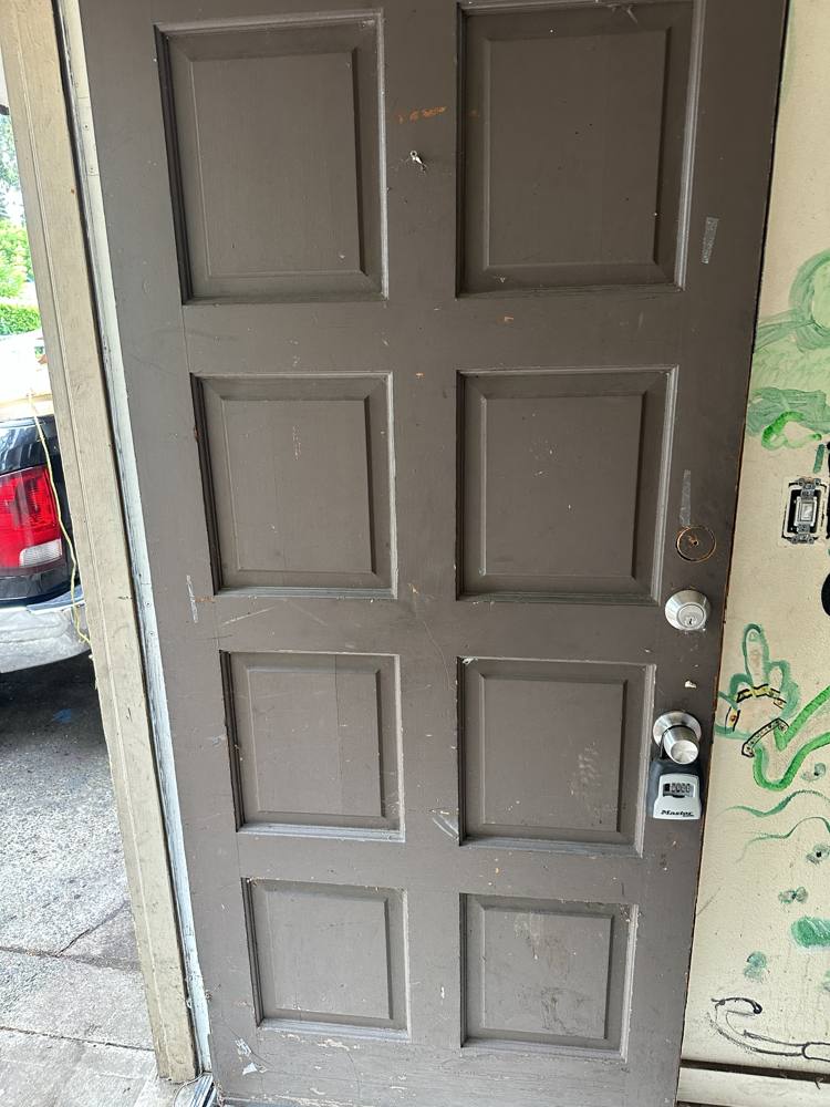 Old front door before replacement