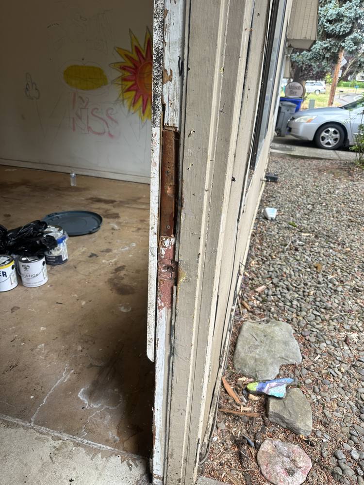 Damaged door frame before replacement