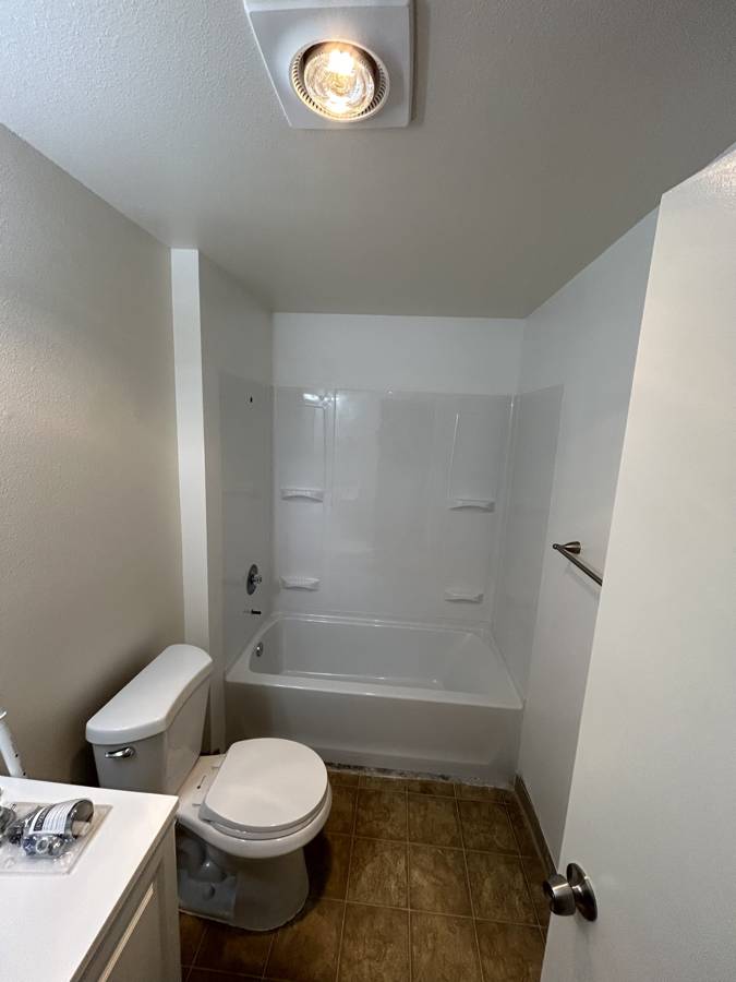After: new tub and surround with built-in shelves