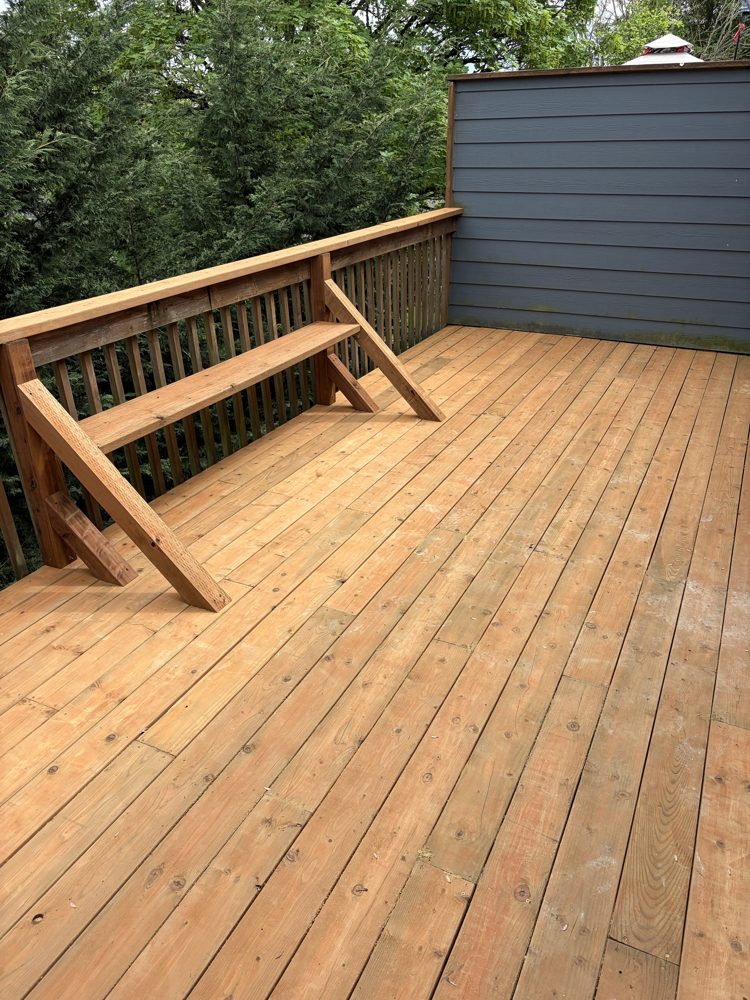 After: new deck boards and rebuilt bench along the railing
