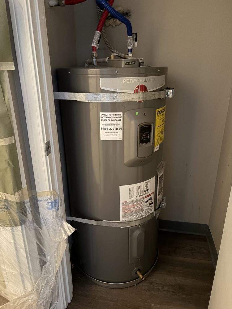New water heater installed in a closet, side view
