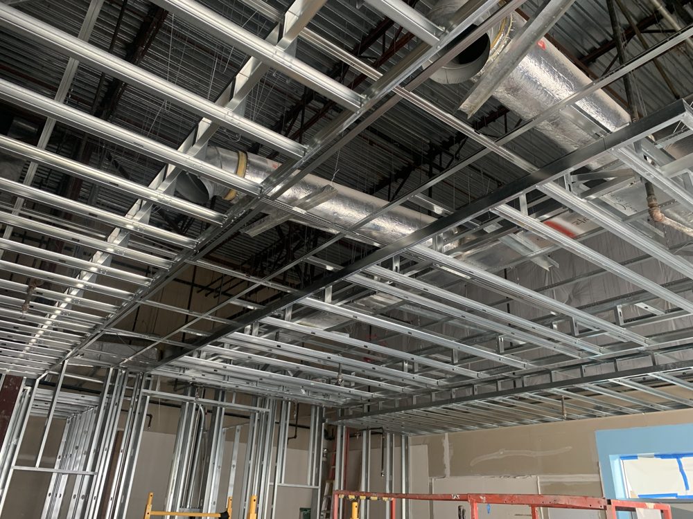 Metal stud ceiling and wall framing in a commercial space