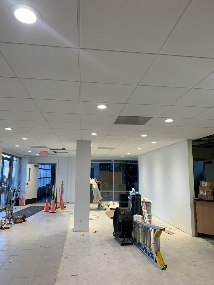 Finished drop ceiling with recessed lights in a retail space