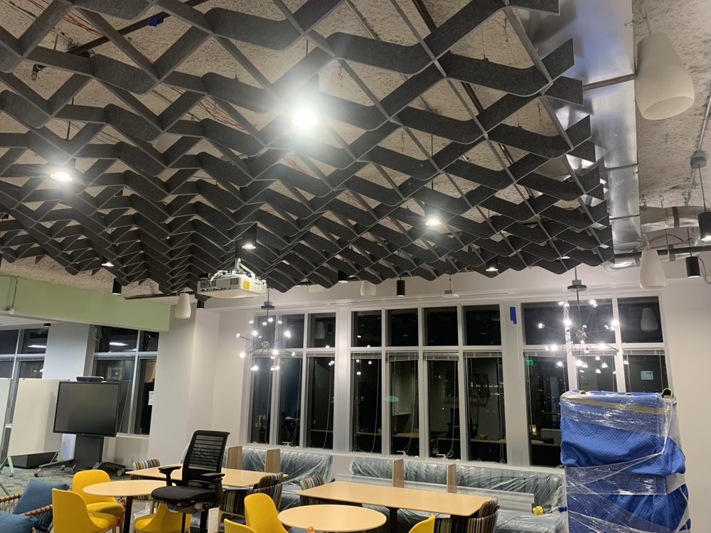 Acoustic baffle ceiling installed in an office common area