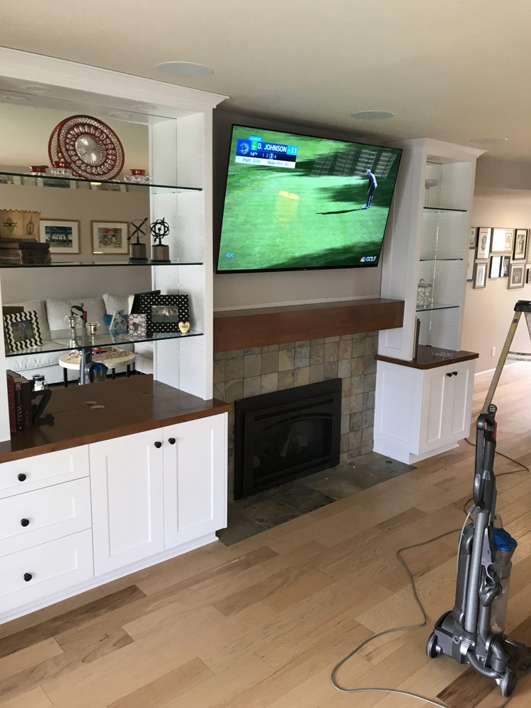 Built-ins, wood mantel and tile fireplace surround, angled view